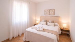 Posteľ alebo postele v izbe v ubytovaní Casa Rocio y Paloma Vinuela by Ruralidays