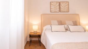 Posteľ alebo postele v izbe v ubytovaní Casa Rocio y Paloma Vinuela by Ruralidays