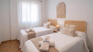 Posteľ alebo postele v izbe v ubytovaní Casa Rocio y Paloma Vinuela by Ruralidays
