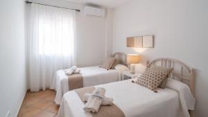 Posteľ alebo postele v izbe v ubytovaní Casa Rocio y Paloma Vinuela by Ruralidays