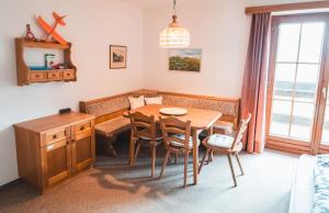 a dining room with a table and chairs at Marki's home in Wiedweg +13 photos