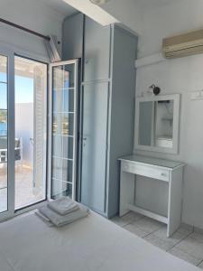 A bed or beds in a room at Agnàntema Portside Stays Skiathos