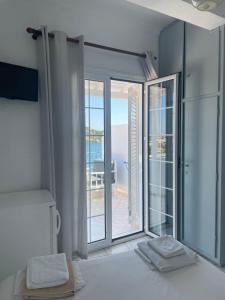 A bed or beds in a room at Agnàntema Portside Stays Skiathos
