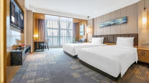 Voodi või voodid majutusasutuse Lyhn International Hotel Chengdu Taikoo Li toas