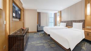 Voodi või voodid majutusasutuse Lyhn International Hotel Chengdu Taikoo Li toas