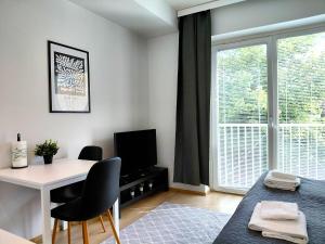 Χώρος καθιστικού στο Kotimaailma Apartments - keskustayksiö - Aleksanterinkatu 20