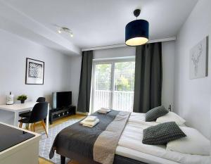 Ένα ή περισσότερα κρεβάτια σε δωμάτιο στο Kotimaailma Apartments - keskustayksiö - Aleksanterinkatu 20