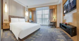 Voodi või voodid majutusasutuse Lyhn International Hotel Chengdu Taikoo Li toas