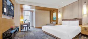 Voodi või voodid majutusasutuse Lyhn International Hotel Chengdu Taikoo Li toas