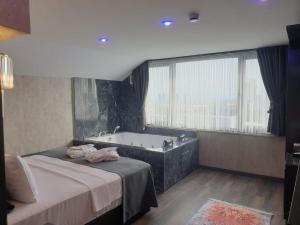 A bed or beds in a room at Golden Dream Otel