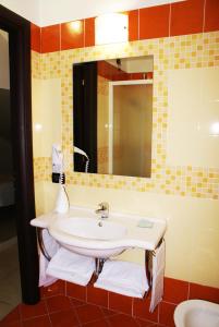 a bathroom with a sink and a mirror at Eco Art Hotel Statuto in Turin