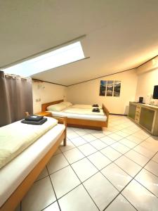 Postel nebo postele na pokoji v ubytování Hotel Wildrose