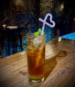 a drink sitting on top of a wooden table at Mota Homestay in Yên Minh