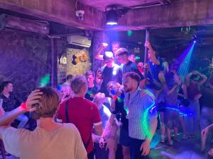 a crowd of people dancing in a club at Mota Homestay in Yên Minh +16 photos