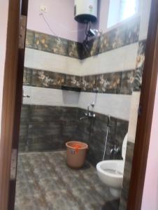 a bathroom with a shower and a toilet and a sink at Sharma Jee Farm House Yercaud in Yercaud