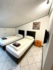Postel nebo postele na pokoji v ubytování Hotel Wildrose