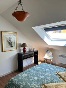 Ένα ή περισσότερα κρεβάτια σε δωμάτιο στο Duplex terrasse