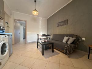 a living room with a couch and a table at Alex Apartment Suites in Virós