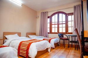 Postel nebo postele na pokoji v ubytování Tashi Pal hotel
