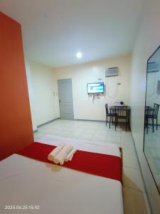 Ένα ή περισσότερα κρεβάτια σε δωμάτιο στο MCT Hotel