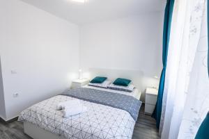 Ένα ή περισσότερα κρεβάτια σε δωμάτιο στο Apartament Lucas Sighișoara
