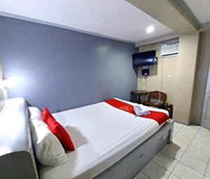 Ένα ή περισσότερα κρεβάτια σε δωμάτιο στο MCT Hotel
