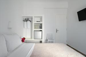Postel nebo postele na pokoji v ubytování Selini Ηotel