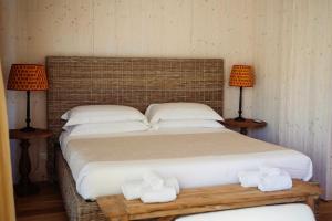 Postel nebo postele na pokoji v ubytování Private Lodge In Tuscan Maremma