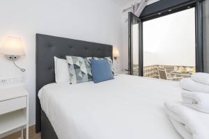 Posteľ alebo postele v izbe v ubytovaní Nueva 22 Suites in Nerja by Solaga Holiday Homes