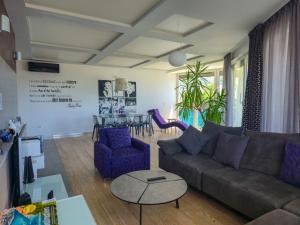 a living room with a couch and a table at Apartment Iva in Omiš
