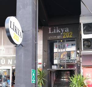 a building with a staircase leading up to a store at Likya 202 in Demre