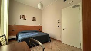 Postel nebo postele na pokoji v ubytování Albergo Salerno