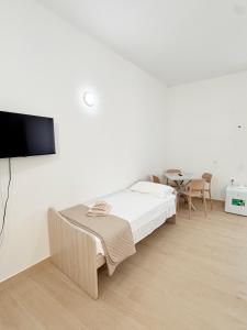 TV a/nebo společenská místnost v ubytování Casa Ferrante