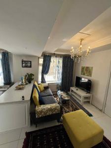 a living room with a couch and a table at Bolod Guesthouse and Tours in Ulaanbaatar
