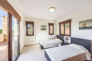 Ένα ή περισσότερα κρεβάτια σε δωμάτιο στο Villa Aqua View +5 φωτογραφίες