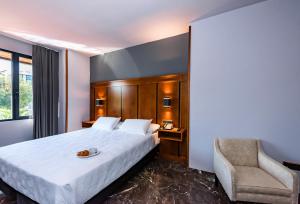 Postel nebo postele na pokoji v ubytování Hotel Condestable Iranzo