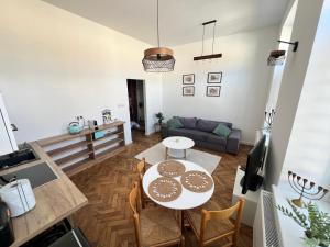 a living room with a table and a couch at Pod Bimą in Tarnów
