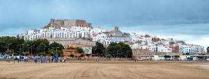 a large white building on top of a hill at Hostal Susi in Peniscola
