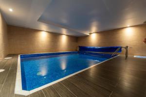 a large swimming pool in a room with at Luxury Vacation Villa in Marbella