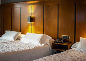 Postel nebo postele na pokoji v ubytování Hotel Condestable Iranzo