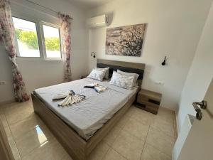 a bedroom with a bed with bananas on it at Treditto House - Ground Floor residence C1 in Koskinou