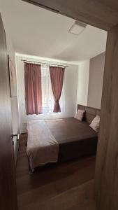 Ένα ή περισσότερα κρεβάτια σε δωμάτιο στο Patricia Apartman Zamárdi