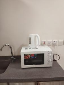 Nhà bếp/bếp nhỏ tại قمة الفخامة 2 للشقق المخدومة