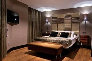 Postel nebo postele na pokoji v ubytování Hotel Condestable Iranzo