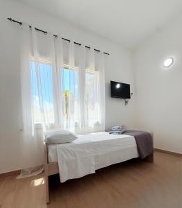 Postel nebo postele na pokoji v ubytování Casa Ferrante