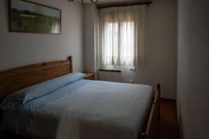 Posteľ alebo postele v izbe v ubytovaní Panther Home Apartamentos Anita