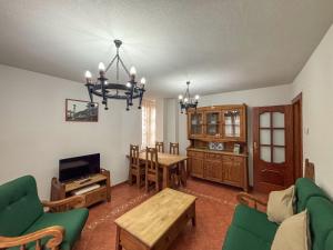 Televízia a/alebo spoločenská miestnosť v ubytovaní Panther Home Apartamentos Anita