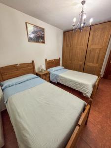 Posteľ alebo postele v izbe v ubytovaní Panther Home Apartamentos Anita