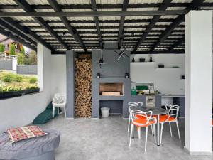 a kitchen and dining room with a table and chairs at Chicago Hotel in Yaremche