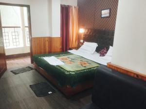 Ένα ή περισσότερα κρεβάτια σε δωμάτιο στο Merry Villas